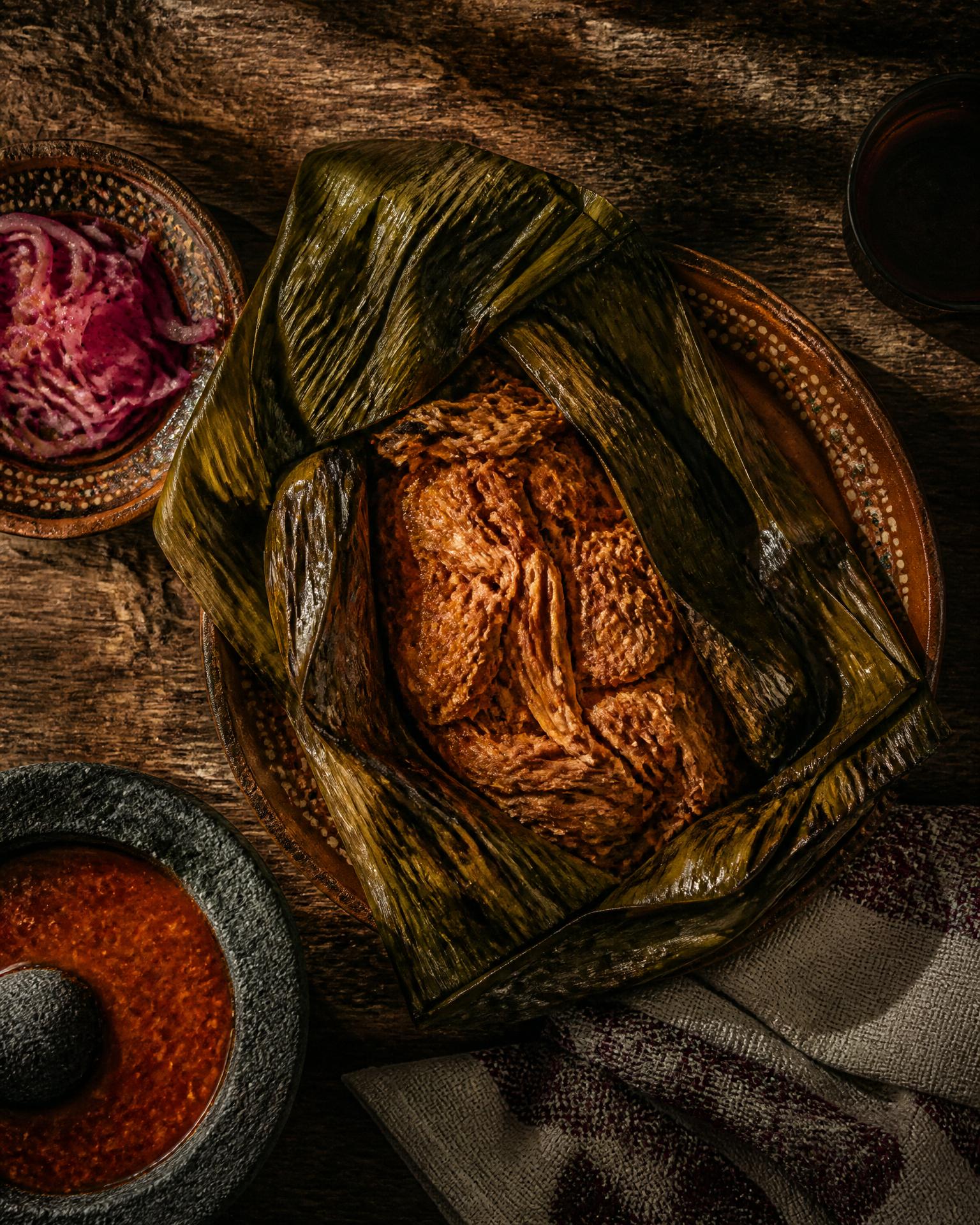 Cochinita pibil wrapped in banana leaves